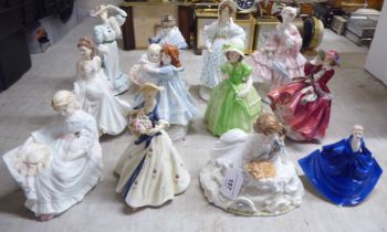 Decorative ceramic figures: to include a Royal Worcester bone china example 'Safe at Last'