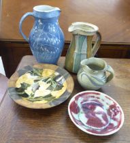 Five items of studio pottery: to include a dish, decorated in colours with autumnal designs  bears