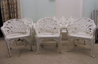A vintage Victorian inspired, white painted, cast metal suite of terrace furniture, in the style