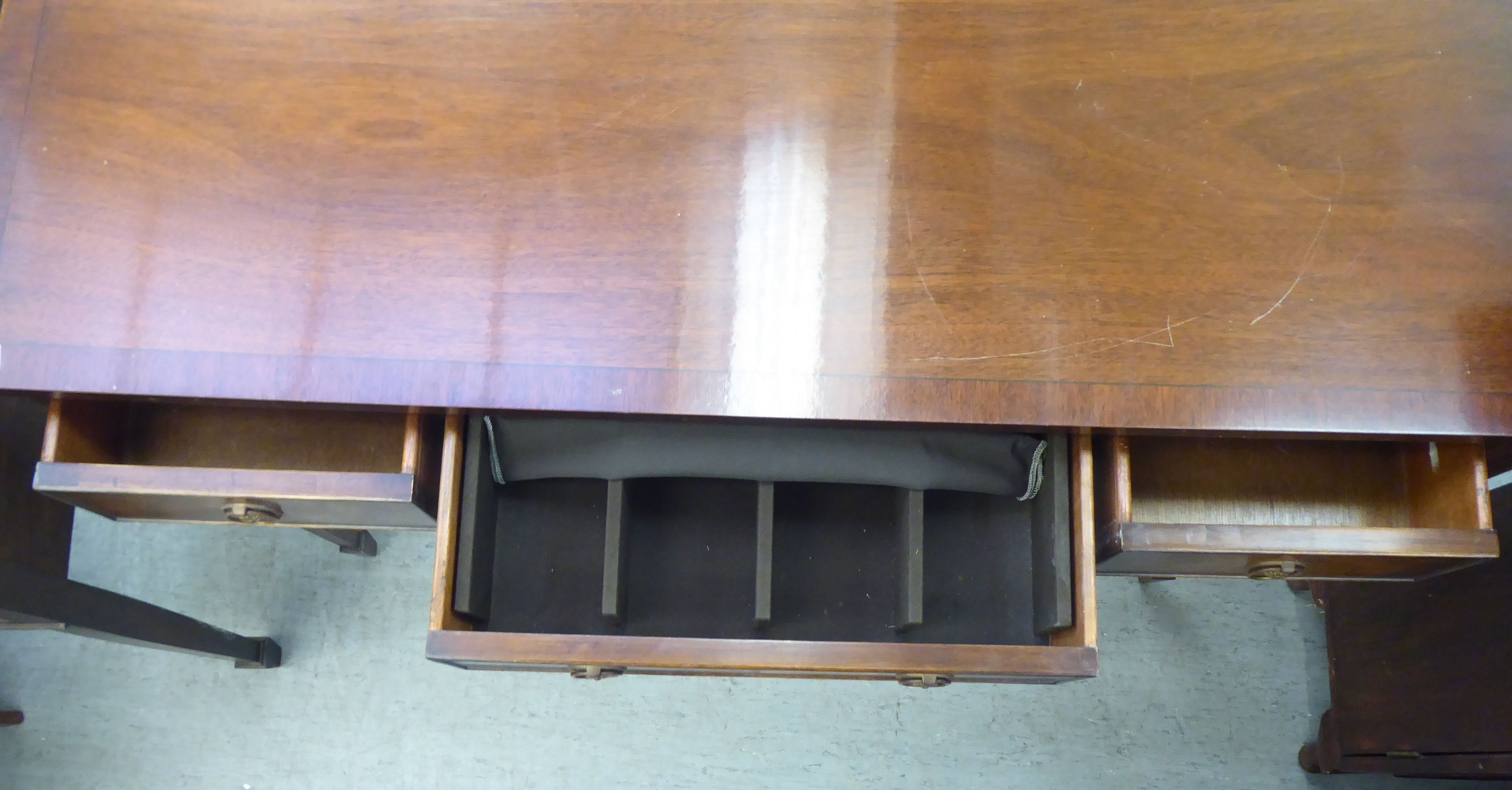 A modern mahogany finished three drawer serving table with cock beading and brass ring handles, - Image 4 of 5