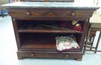 A late 19thC Continental walnut open front cabinet with a mottled grey marble top, over a cushion