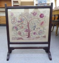 A 1920s oak framed tapestry panel, freestanding firescreen, depicting stylised birds and flora  31"h