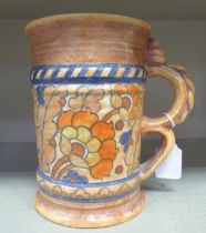 A Charlotte Rhead for Crown Ducal jug, decorated with floral patterns