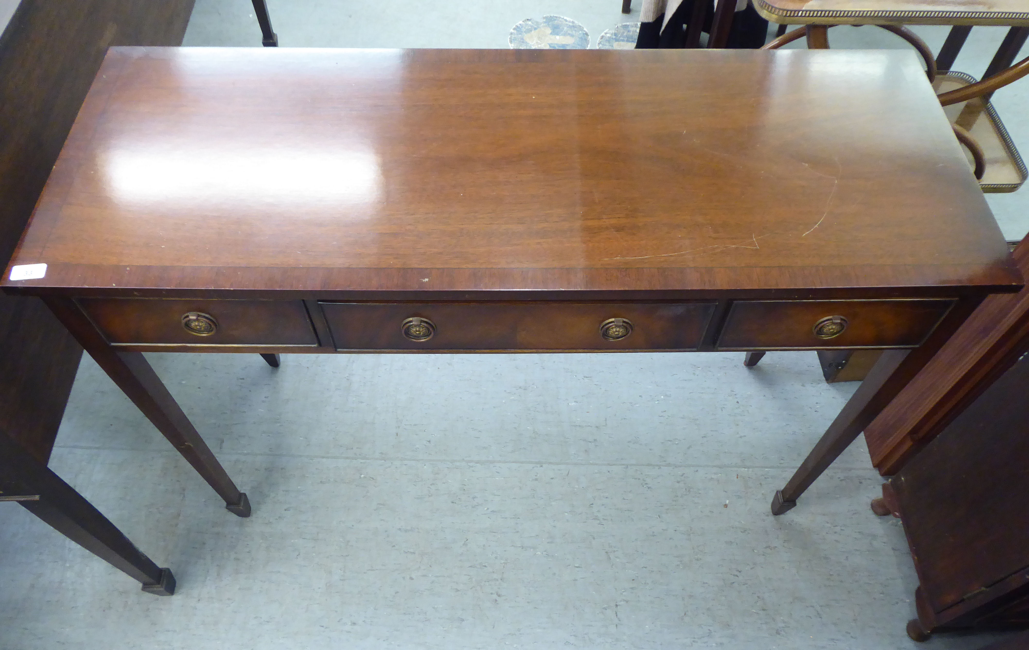 A modern mahogany finished three drawer serving table with cock beading and brass ring handles, - Image 2 of 5
