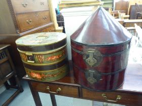 Two dissimilar painted tinplate and other hat boxes  largest 18"h