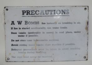 A World War II black on white enamelled steel sign for 'Precautions connected with the handling
