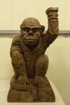 A carved wooden figure, a monkey posing as a waiter  18"h