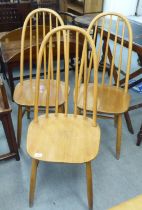 Three Ercol style beech and elm framed, spindle back chairs  (no labels present)