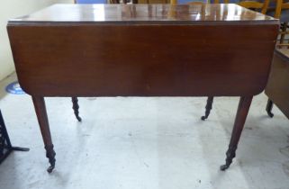 A late 19thC mahogany Pembroke table, raised on turned legs and casters  28"h  38"w