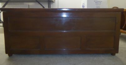 A mid 20thC brown painted beech chest with straight sides and a hinged lid  17"h  42"w