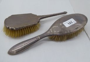 Two silver backed dressing table hair brushes  mixed marks