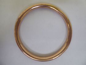 A 9ct gold hollow bangle