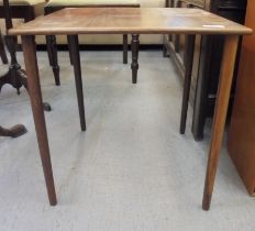 A Farum, Made in Denmark, rosewood lamp table, model no.9840, raised on turned, tapered legs  18"