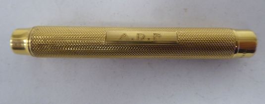 A Sampson Mordan 18ct gold pencil holder with engine turned decoration