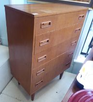 A 1970s teak five drawer dressing chest, raised on tapered legs  41"h  30"w