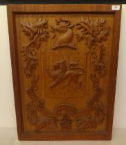 A carved oak armorial panel  30" x 23"