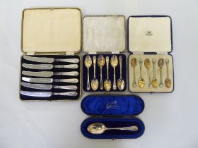 Cased silver presentation spoons: to include a set of six gilded and coloured enamelled coffee