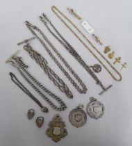 Items of personal ornament: to include a 9ct gold crucifix pendant; and gold and silver watch chains