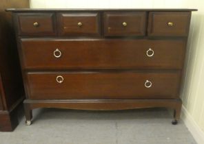 A Stag Minstrel style mahogany six drawer dressing chest, raised on bracket feet  28"h  43"w