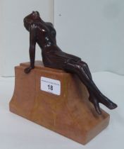 An Art Deco bronze figure, a reclining woman, on a marble plinth  7.25"h