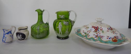 A mixed lot: to include two Mary Gregory style, clear and green glass jugs
