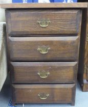 A modern traditional style oak four drawer pedestal chest, on block ends  30"h  21"w
