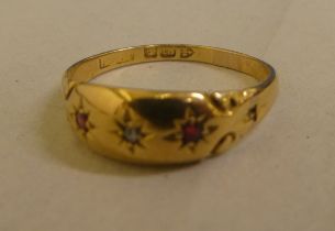 An 18ct gold ruby and diamond gypsy ring