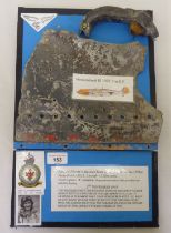 Framed fragment pieces, believed to be from a circa 1940 Messerschmitt BF 109E-7 aircraft (Please