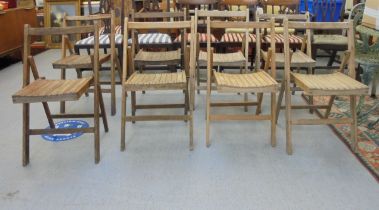 A set of eight Air Ministry beech framed folding chairs, some bearing AM marks
