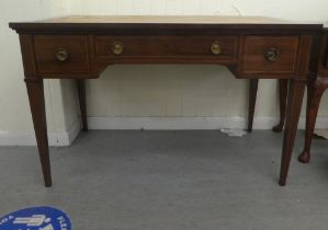 An Edwardian string inlaid mahogany three drawer desk, raised on square, tapered legs  30"h  47"w