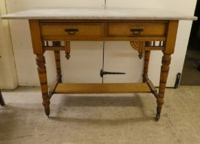 An Edwardian satinwood washstand with a grey marble top, two drawers and a platform undershelf  29"h