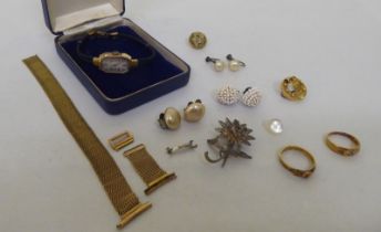 Items of personal ornament: to include a lady's 9ct gold cased wristwatch; and an 18ct gold ring,