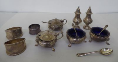 Silver tableware: to include a four piece cruet; and a pair of napkin rings  mixed marks