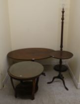 Small furniture: to include a modern mahogany finished, oval coffee table, over a central column,