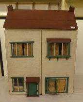 A scratch built doll's house with a double opening front, containing various furniture  32"h  26"w