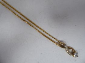 A 9ct gold pendant necklace, set with diamonds