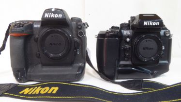 Two Nikon cameras, viz. an AD2H and an AF4