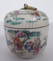 A Chinese porcelain jar and cover, decorated with figures, in a garden  bears a printed character