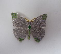 A bi-coloured gold, diamond encrusted and coloured stone set brooch, fashioned as a butterfly