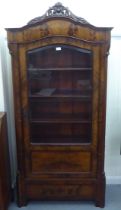 A late 19thC mahogany vitrine with a glazed door, enclosing four shelves, on a bracket plinth  74"h