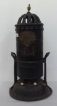 A vintage Wright & Butler of Birmingham cast black painted metal heating stove of tower design  24"h