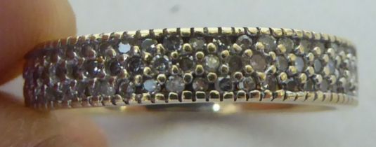 A 9ct gold diamond encrusted half eternity ring