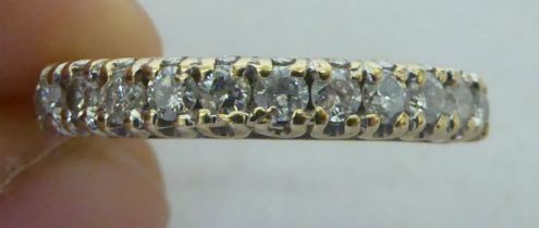 A 9ct gold diamond set half eternity ring