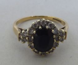 A 9ct gold diamond and sapphire cluster ring