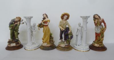 A pair of Franklin Mint porcelain candlesticks, fashioned as figures 'Romeo & Juliette' each