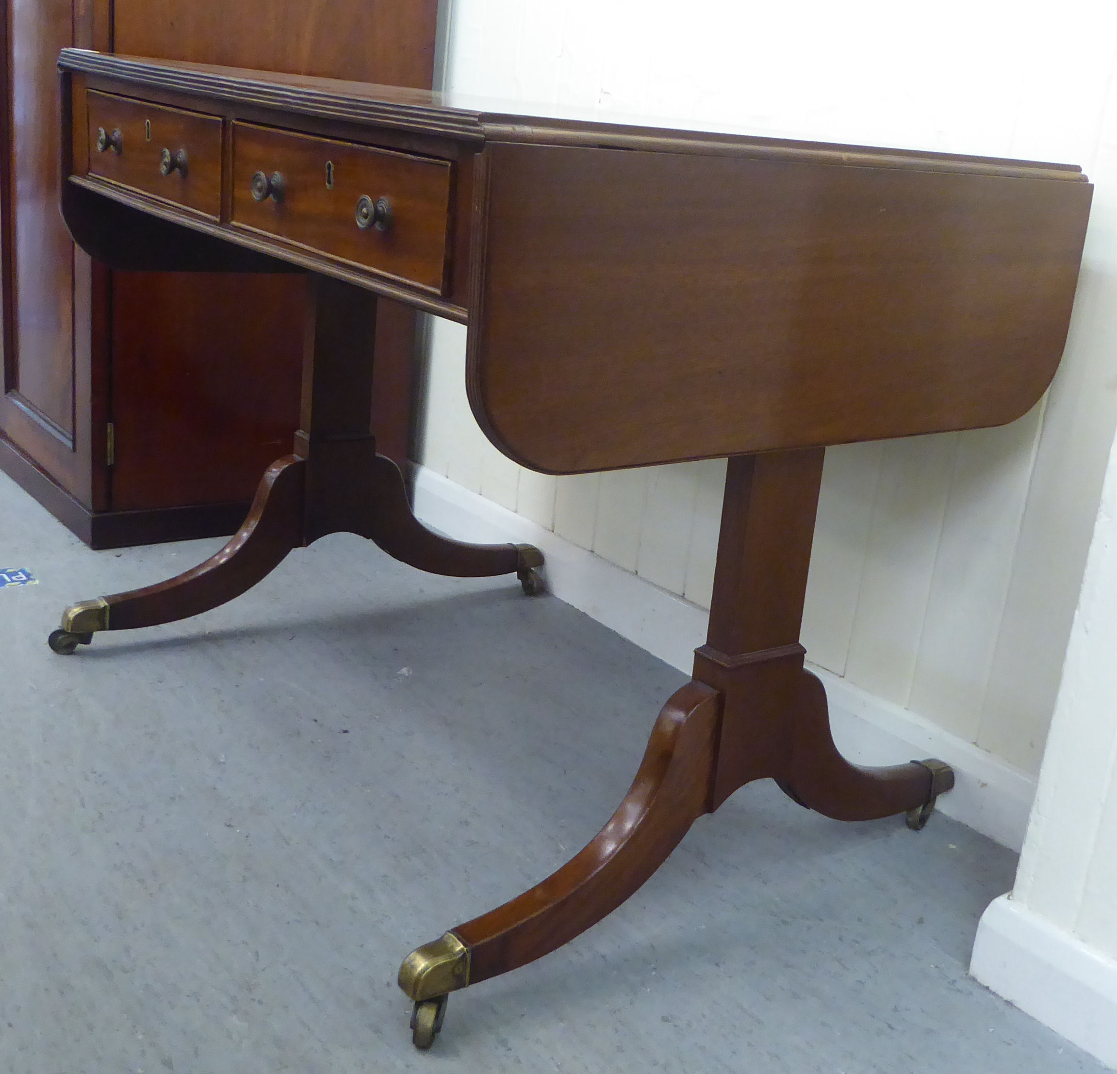 A late 19thC mahogany sofa table with two frieze drawers and two facsimiles on the obverse, raised - Image 3 of 3