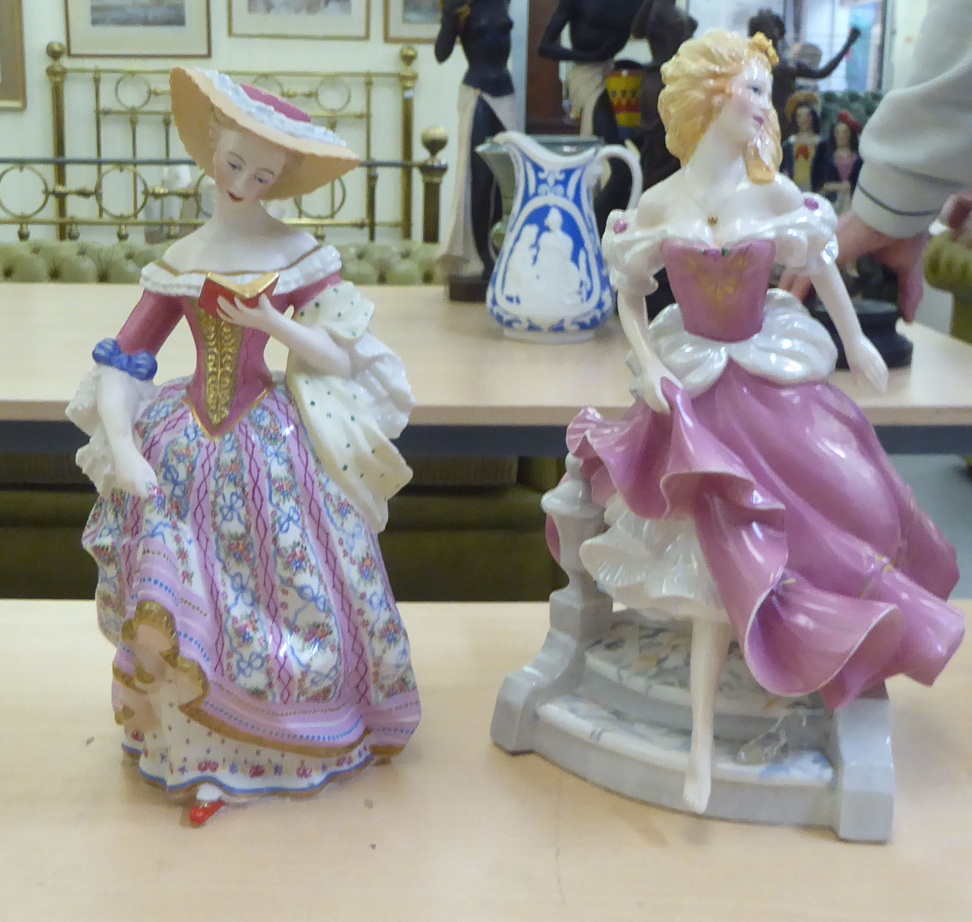 A cream coloured composition figure, a woman in Edwardian costume, carrying a basket of fruit  18"h; - Image 2 of 3