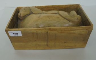 A wooden sculpture, featuring a pair of sleeping puppies  5"h  10"w