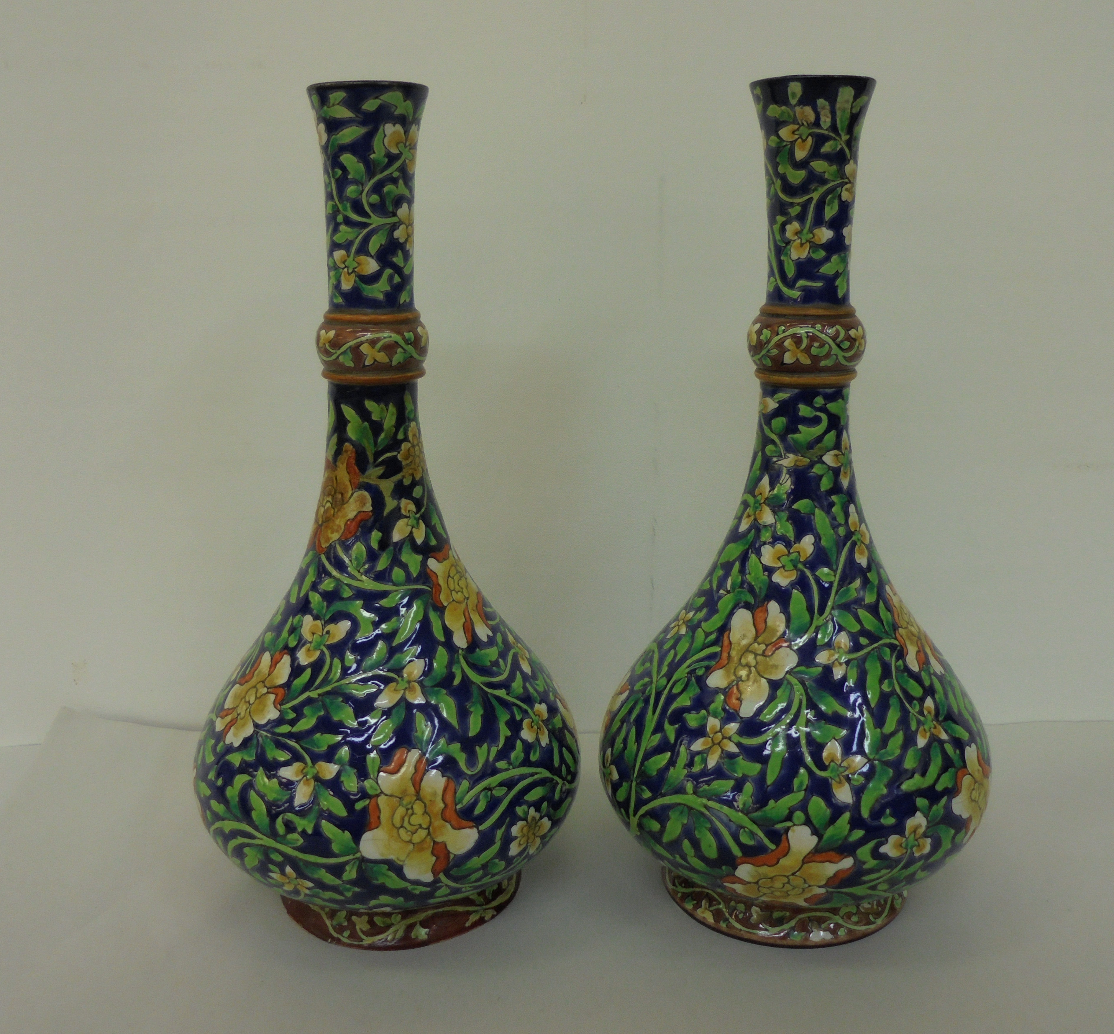 A pair of British Art pottery Arts & Crafts faience vases, decorated in colours with scrolled - Image 2 of 5