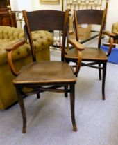 A pair of early 20thC Thonet beech framed bentwood chairs with solid backs, seats and open arms,